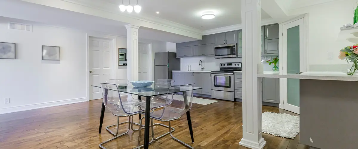 Modern Basement Kitchen with Hardwood Floors - Spacious basement with a full kitchen, hardwood floors, and elegant finishes.